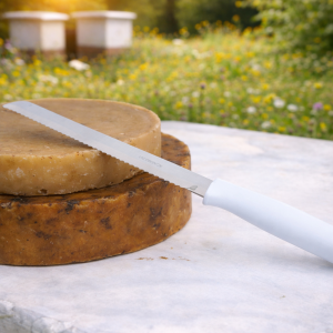 Cuchillo desoperculador con mango plastico;